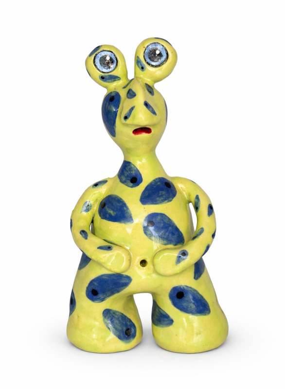 Coastal clay works monster with expressive sculpted features.