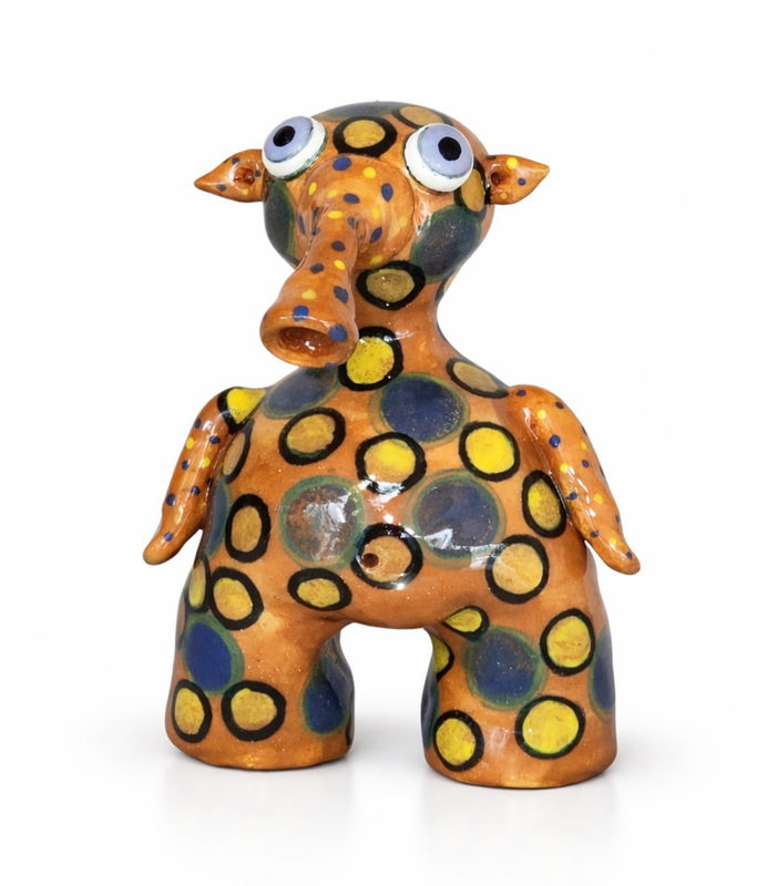 Shoreling fantasy monster sculpture with organic clay texture.