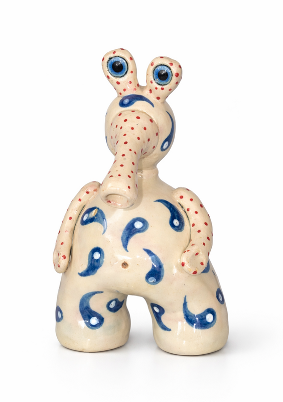 Whimsical clay monster with earthy glaze.
