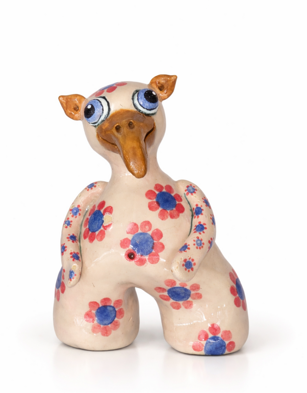 Handcrafted Shoreling clay monster with expressive features.